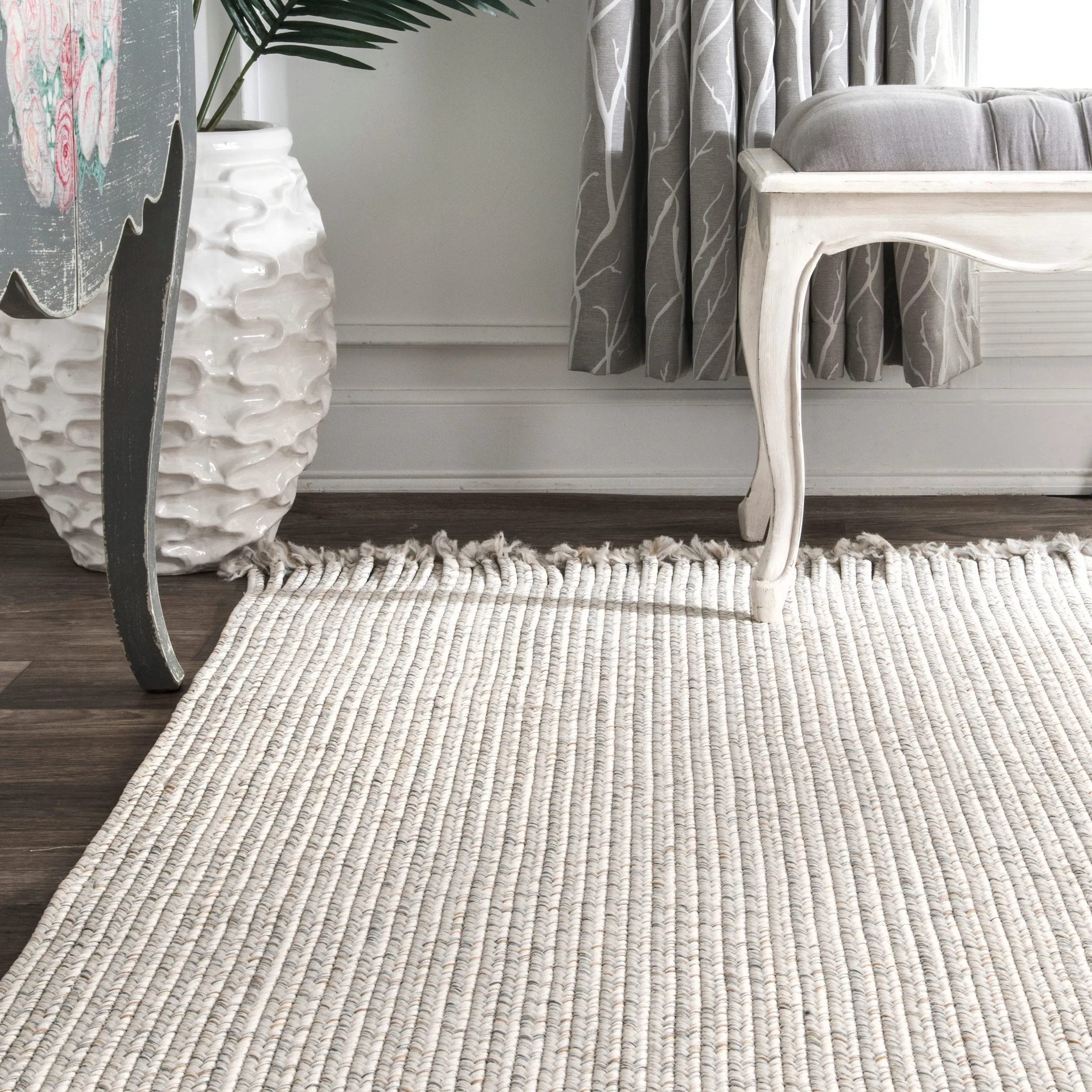 BRAIDED COURT TASSEL PEPPER RUG