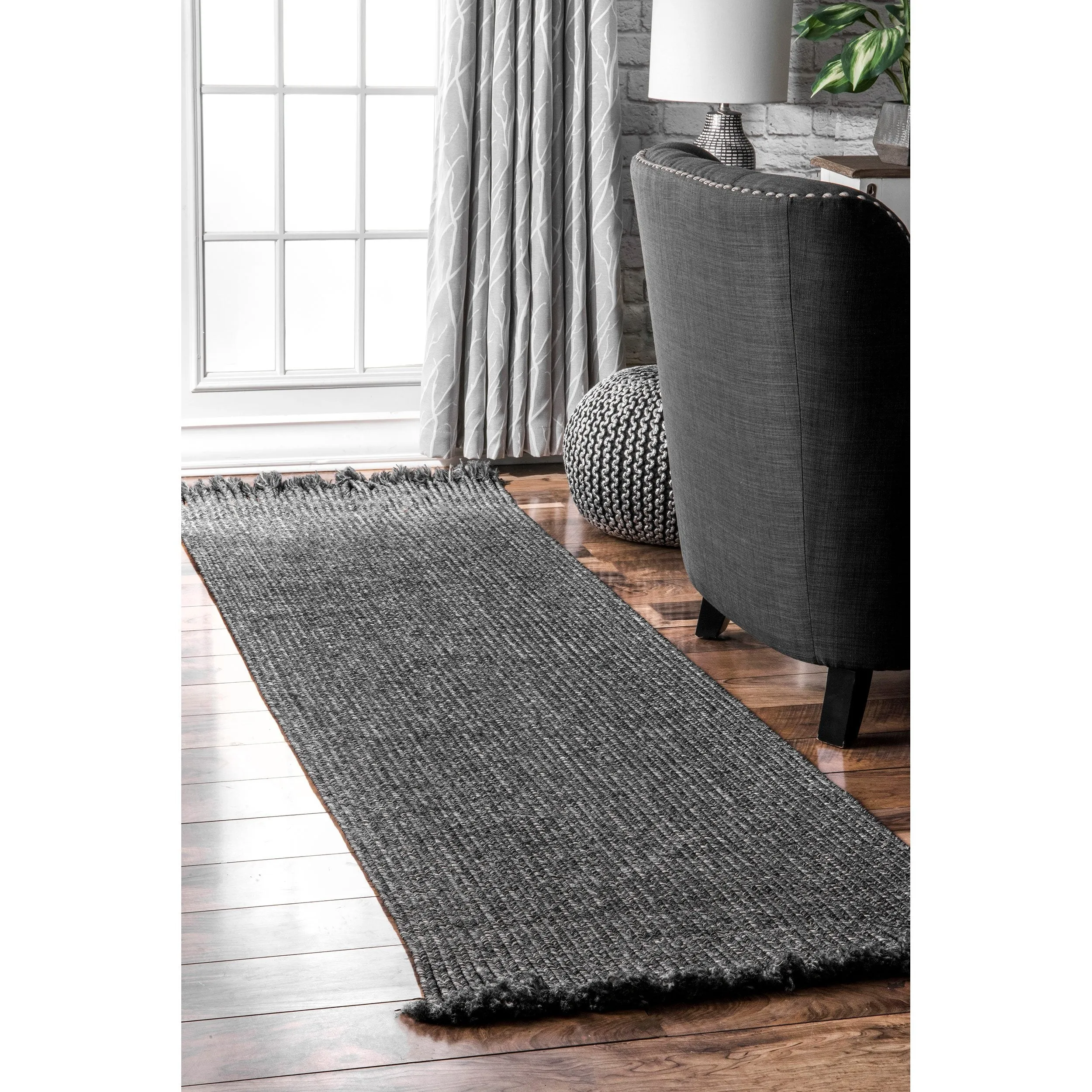 BRAIDED COURT TASSEL PEPPER RUG