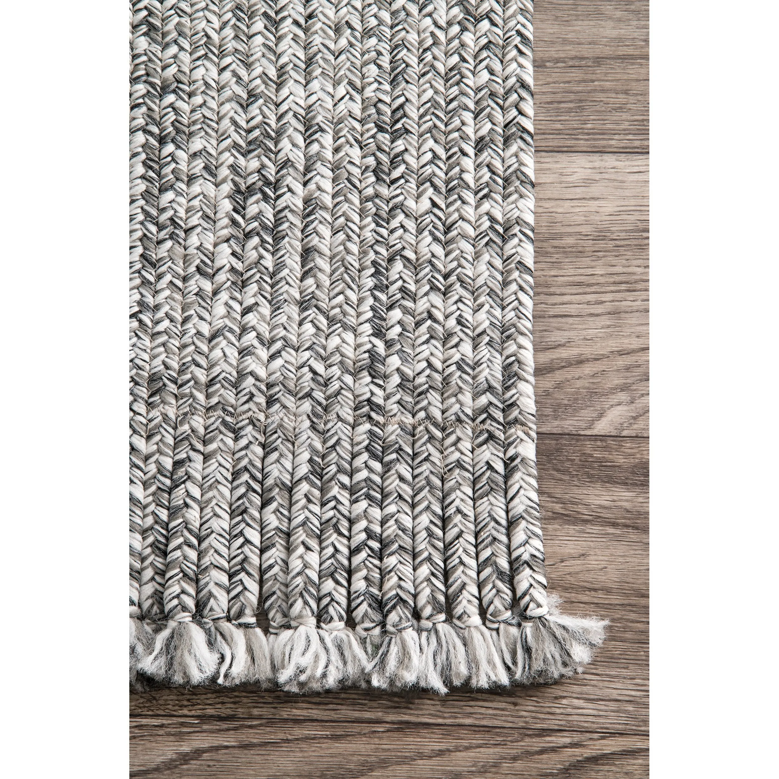 BRAIDED COURT TASSEL PEPPER RUG