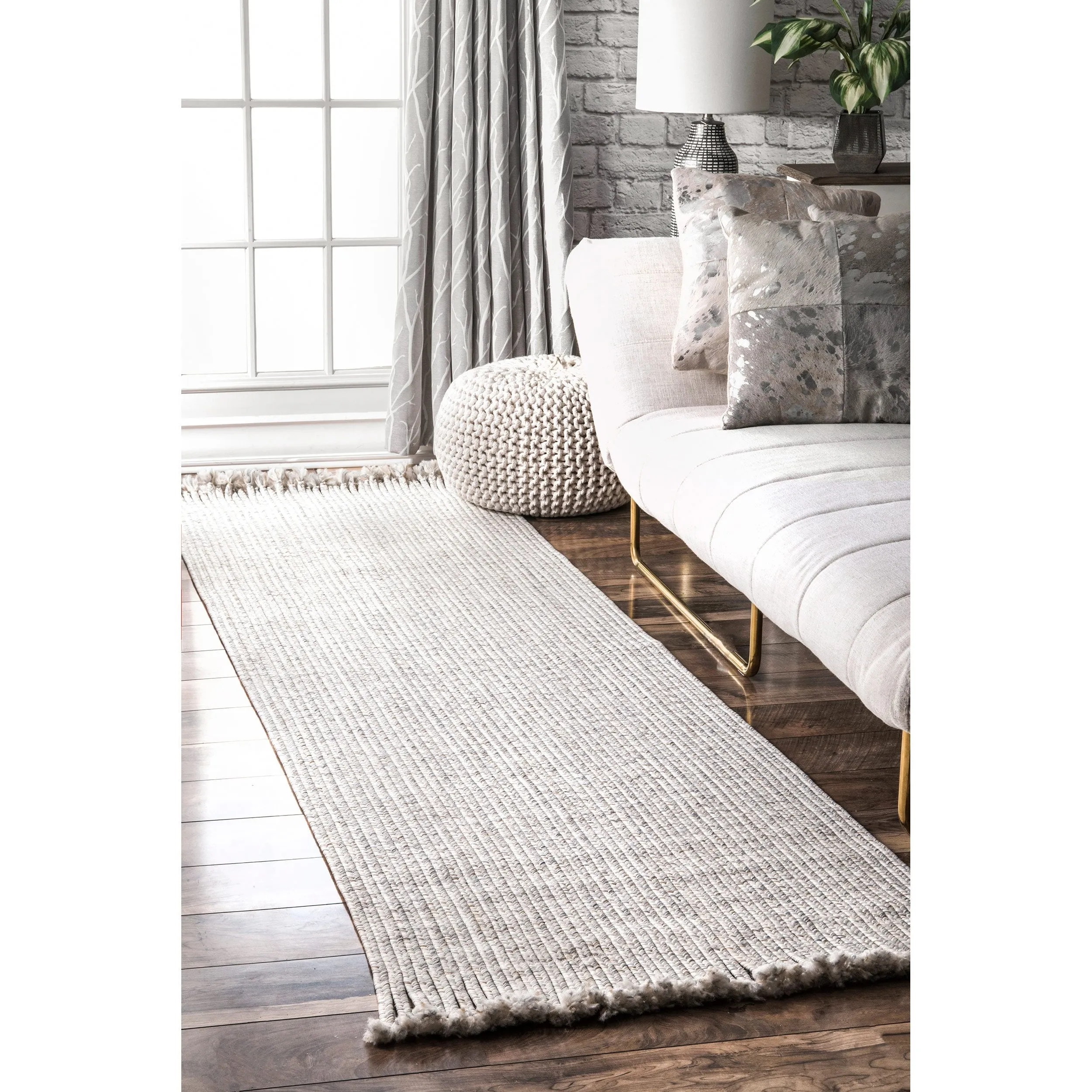 BRAIDED COURT TASSEL PEPPER RUG