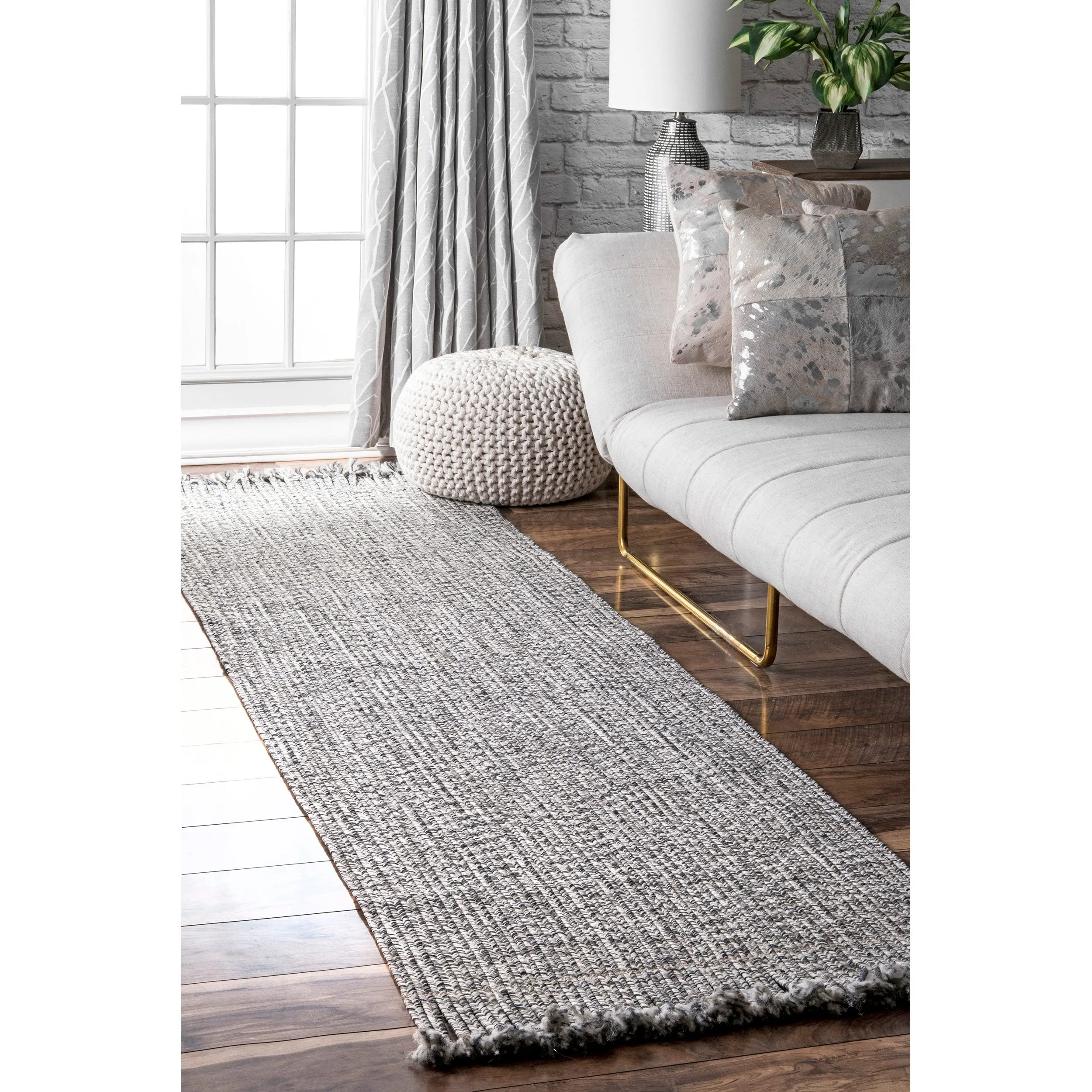BRAIDED COURT TASSEL PEPPER RUG